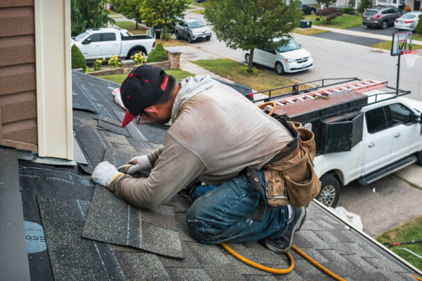 Professional Roofing technician working in University Park, IA